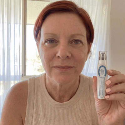 Customer presenting the 7-Day Skin Restoration Serum Pen
